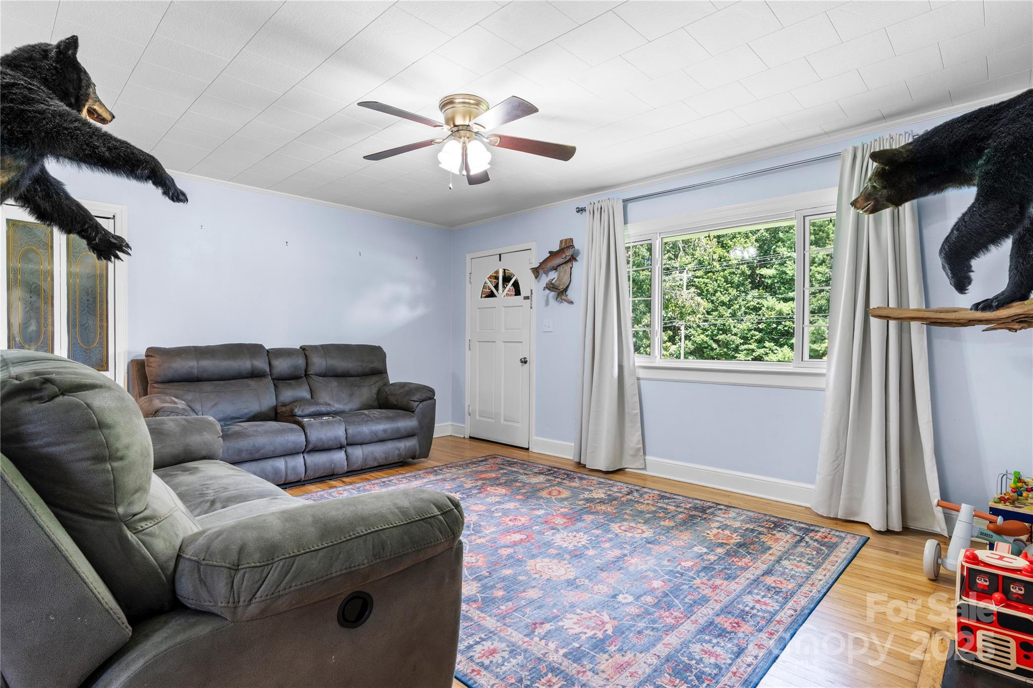 1838 Connelly Springs Road Lenoir, NC 28645 - Photo 6 of 24 a living room with furniture and a flat screen tv