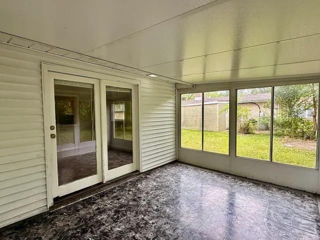 a view of an empty room with a window