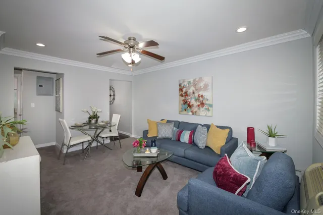 a living room with furniture and a rug