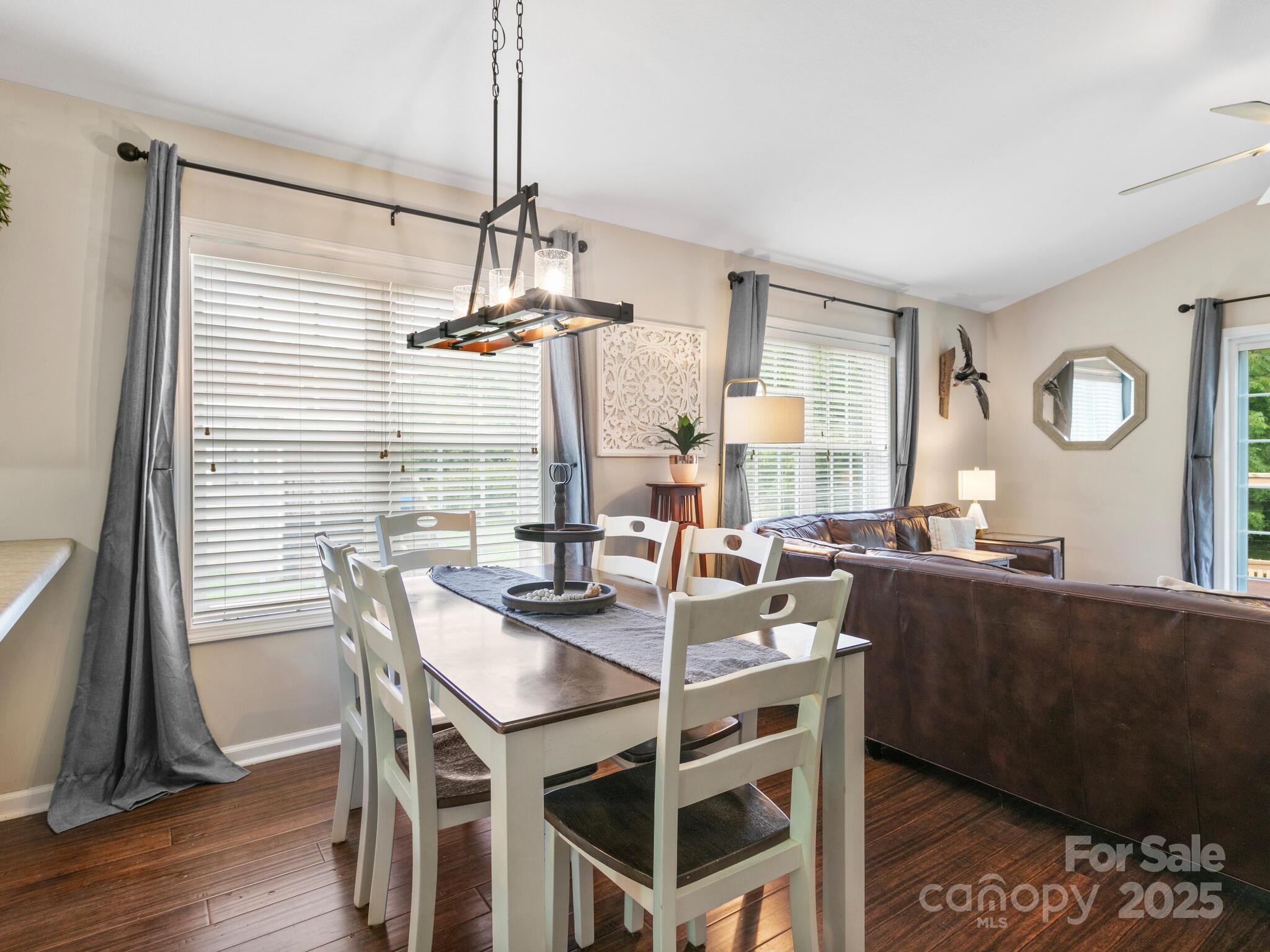 61 Village Street Clyde, NC 28721 - Photo 14 of 30 a view of a dining room with furniture and wooden floor