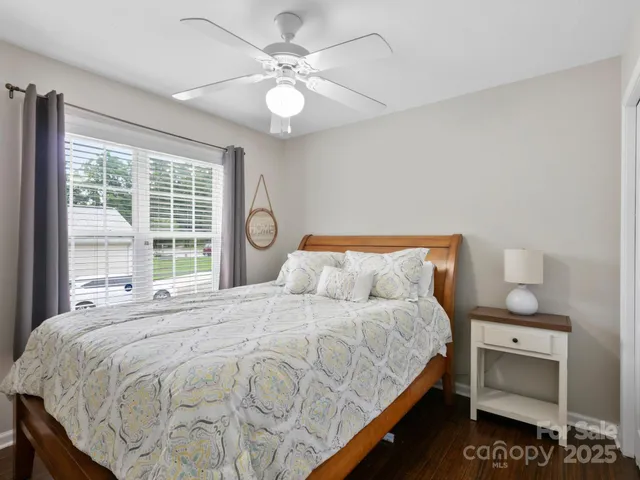 a bedroom with bed and window