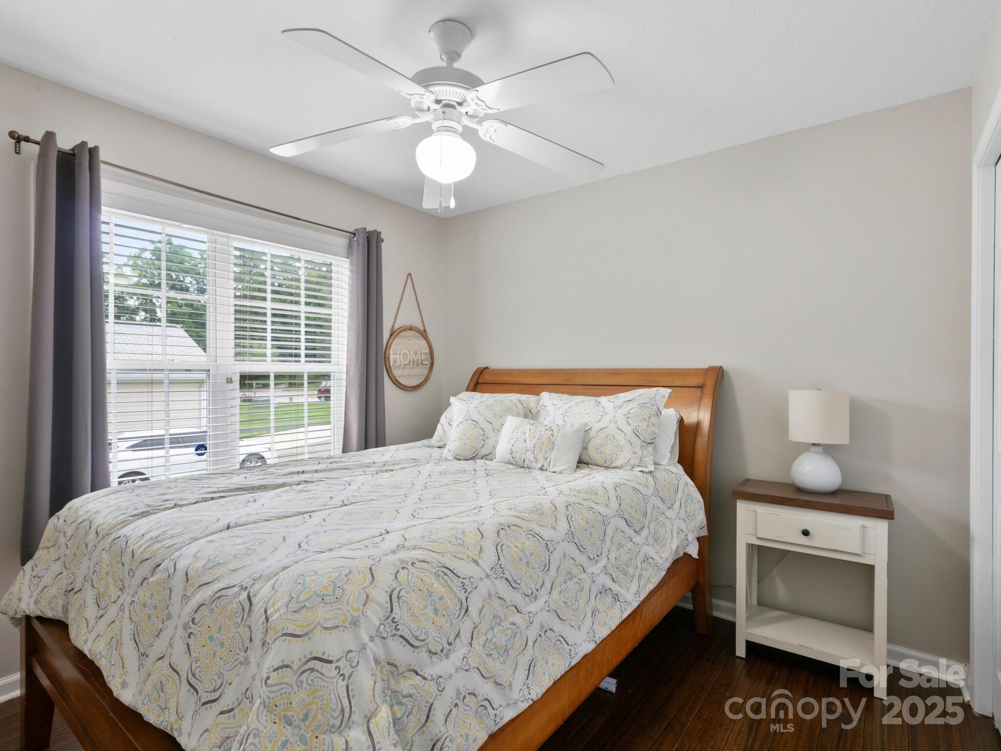 61 Village Street Clyde, NC 28721 - Photo 20 of 30 a bedroom with bed and window