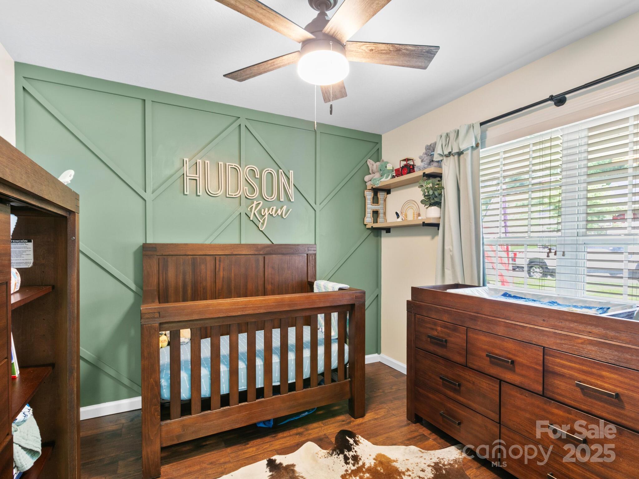 61 Village Street Clyde, NC 28721 - Photo 22 of 30 a bedroom with furniture and a window