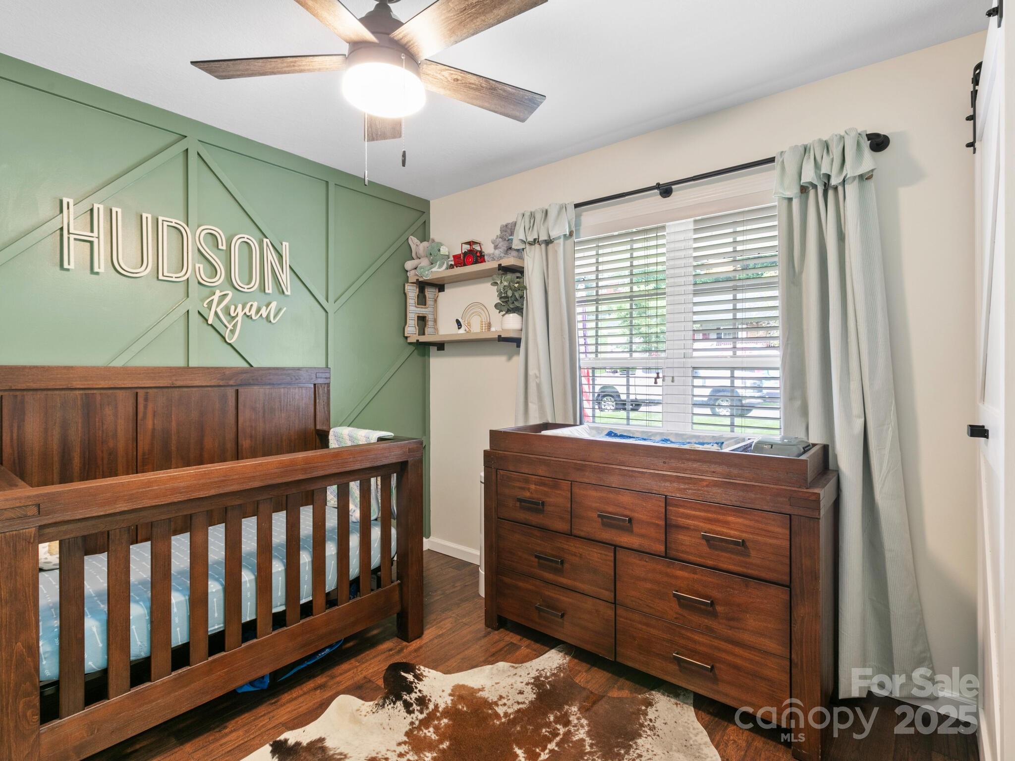 61 Village Street Clyde, NC 28721 - Photo 23 of 30 a room with furniture and a window