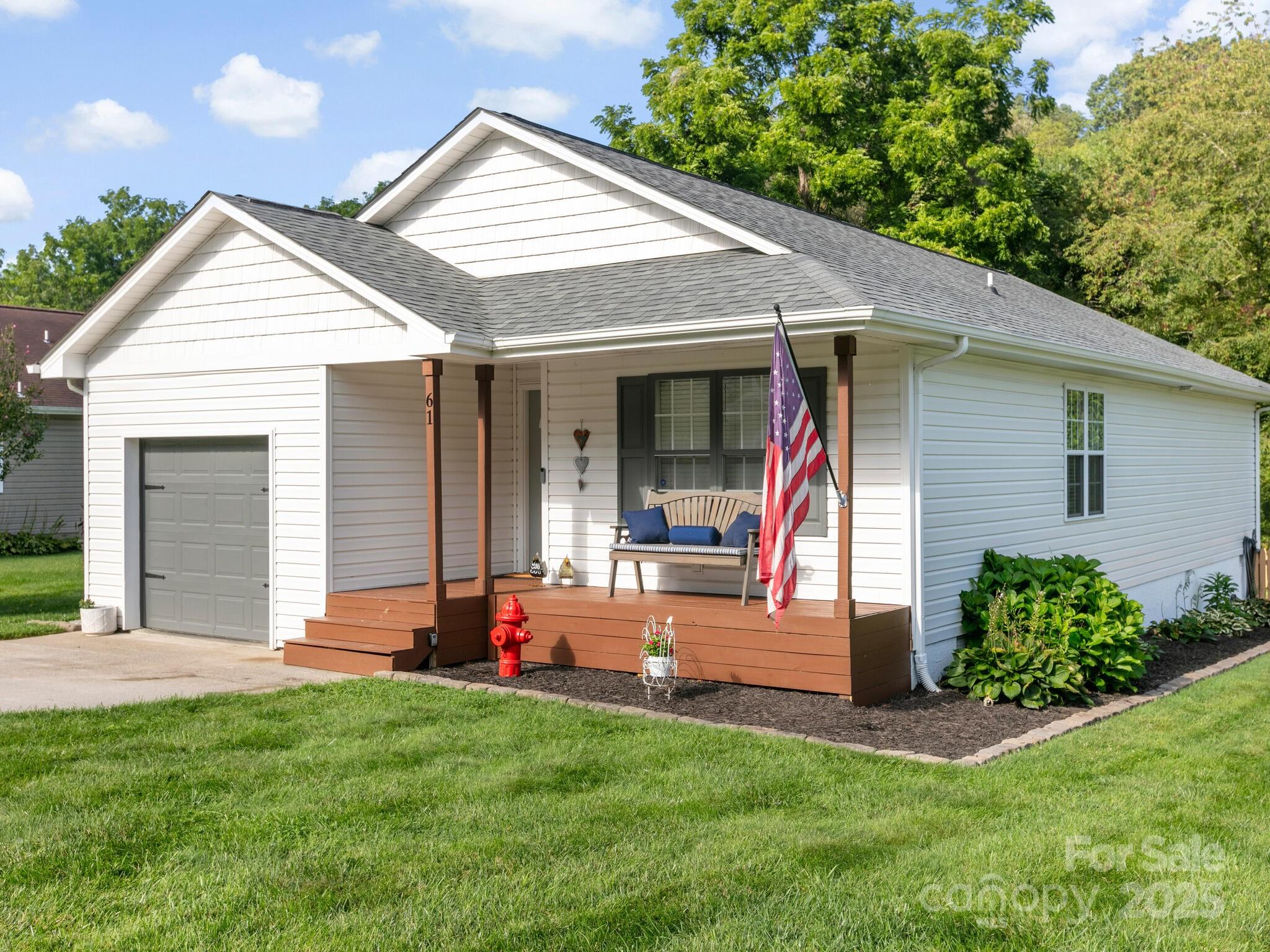 61 Village Street Clyde, NC 28721 - Photo 3 of 30 a front view of a house with a yard
