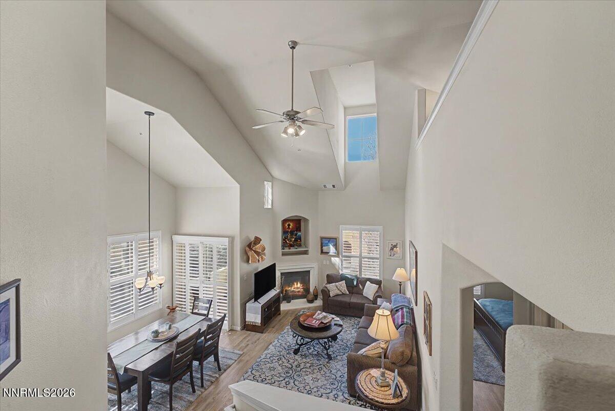 a view of a livingroom with furniture and a floor to ceiling window