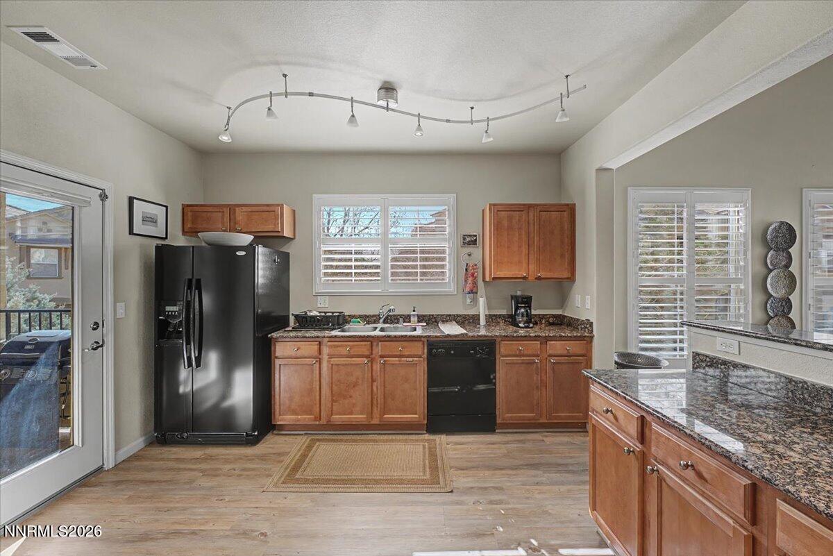 17000 Wedge Parkway, Unit 2625 Reno, NV 89511 - Photo 12 of 42 a kitchen with stainless steel appliances granite countertop a stove refrigerator and sink