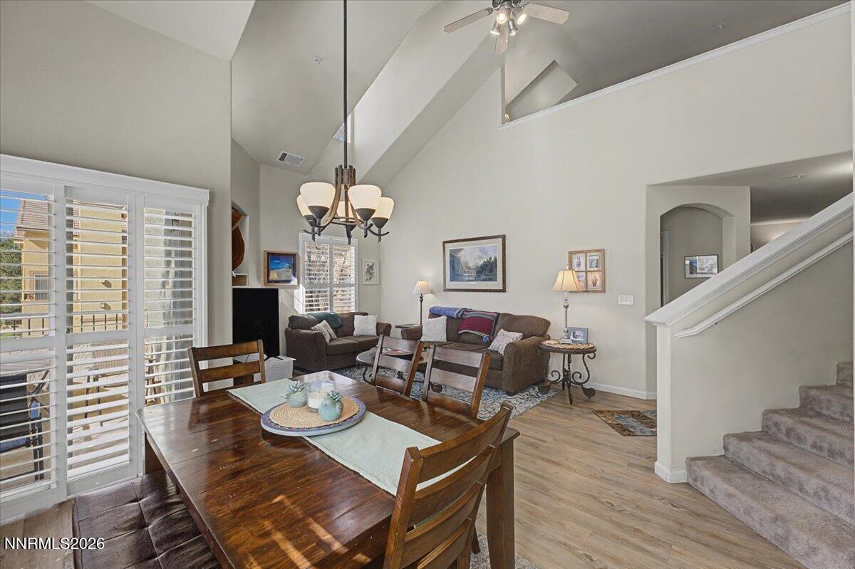 17000 Wedge Parkway, Unit 2625 Reno, NV 89511 - Photo 13 of 42 a view of a dining room with furniture a chandelier and wooden floor