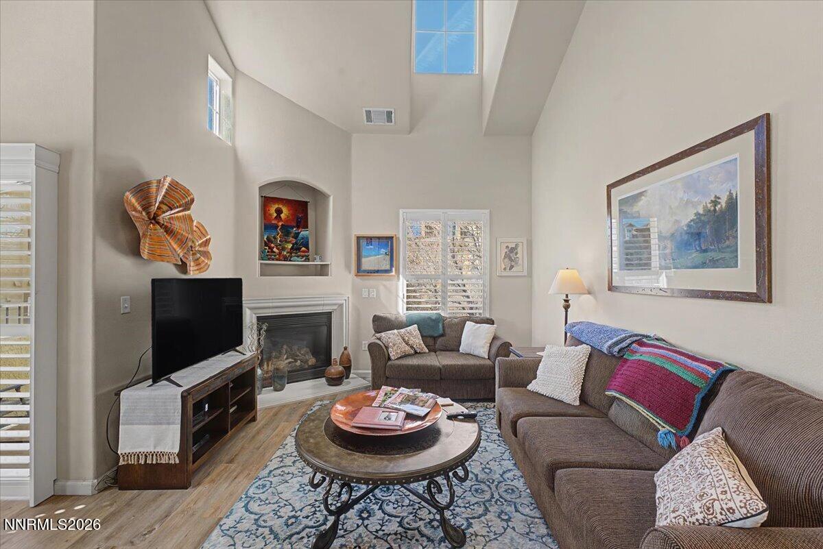17000 Wedge Parkway, Unit 2625 Reno, NV 89511 - Photo 15 of 42 a living room with furniture a flat screen tv and a fireplace