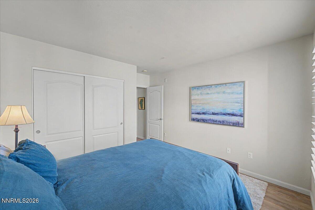 17000 Wedge Parkway, Unit 2625 Reno, NV 89511 - Photo 21 of 42 a bedroom with a bed and a lamp