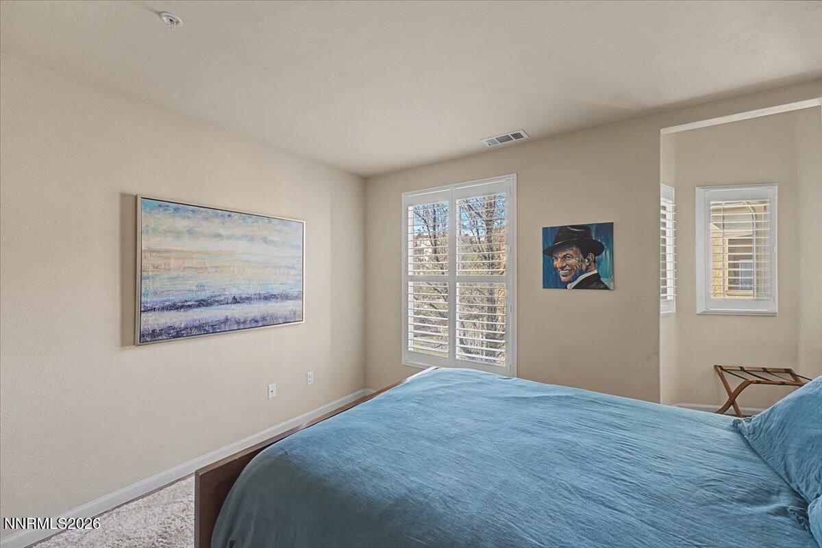 17000 Wedge Parkway, Unit 2625 Reno, NV 89511 - Photo 22 of 42 a bedroom with a bed and a window