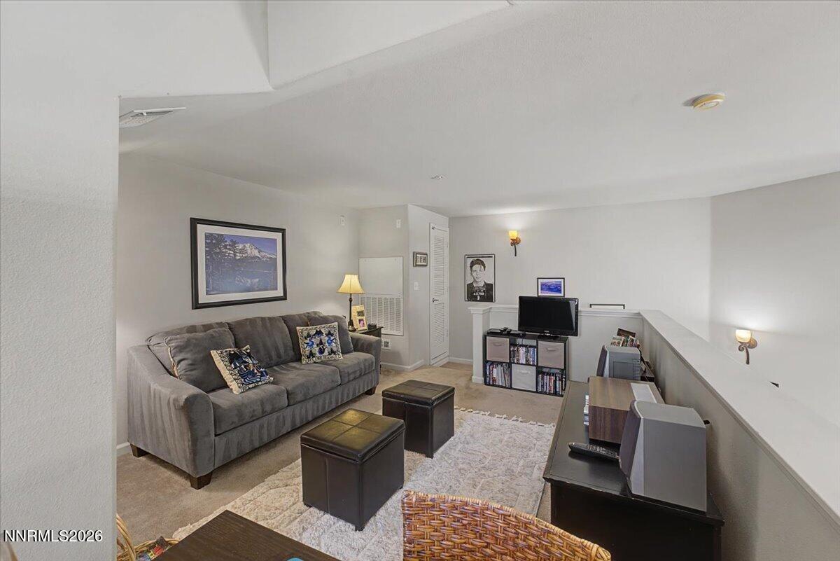 17000 Wedge Parkway, Unit 2625 Reno, NV 89511 - Photo 26 of 42 a living room with furniture and a flat screen tv