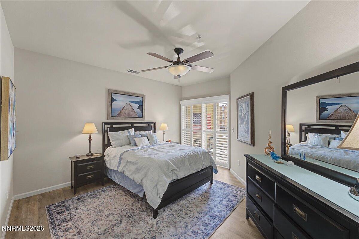 17000 Wedge Parkway, Unit 2625 Reno, NV 89511 - Photo 3 of 42 a bedroom with a bed and wooden floor