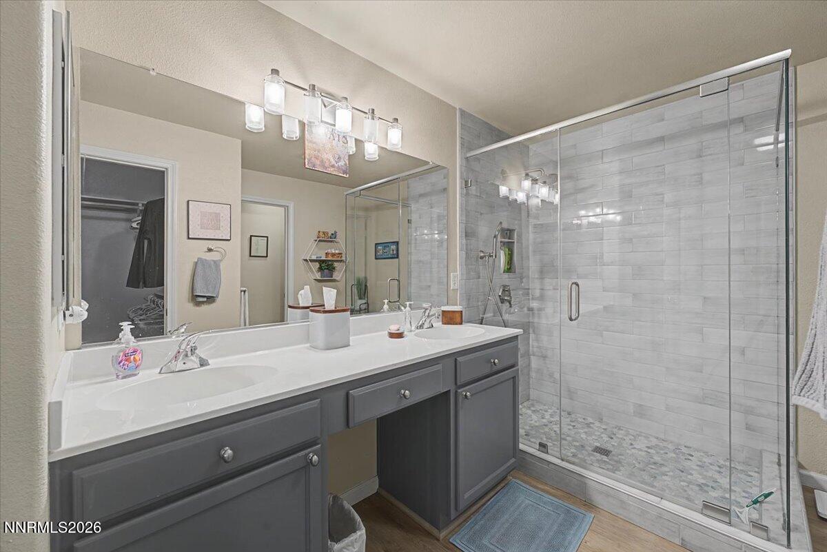17000 Wedge Parkway, Unit 2625 Reno, NV 89511 - Photo 6 of 42 a bathroom with a double vanity sink mirror and shower