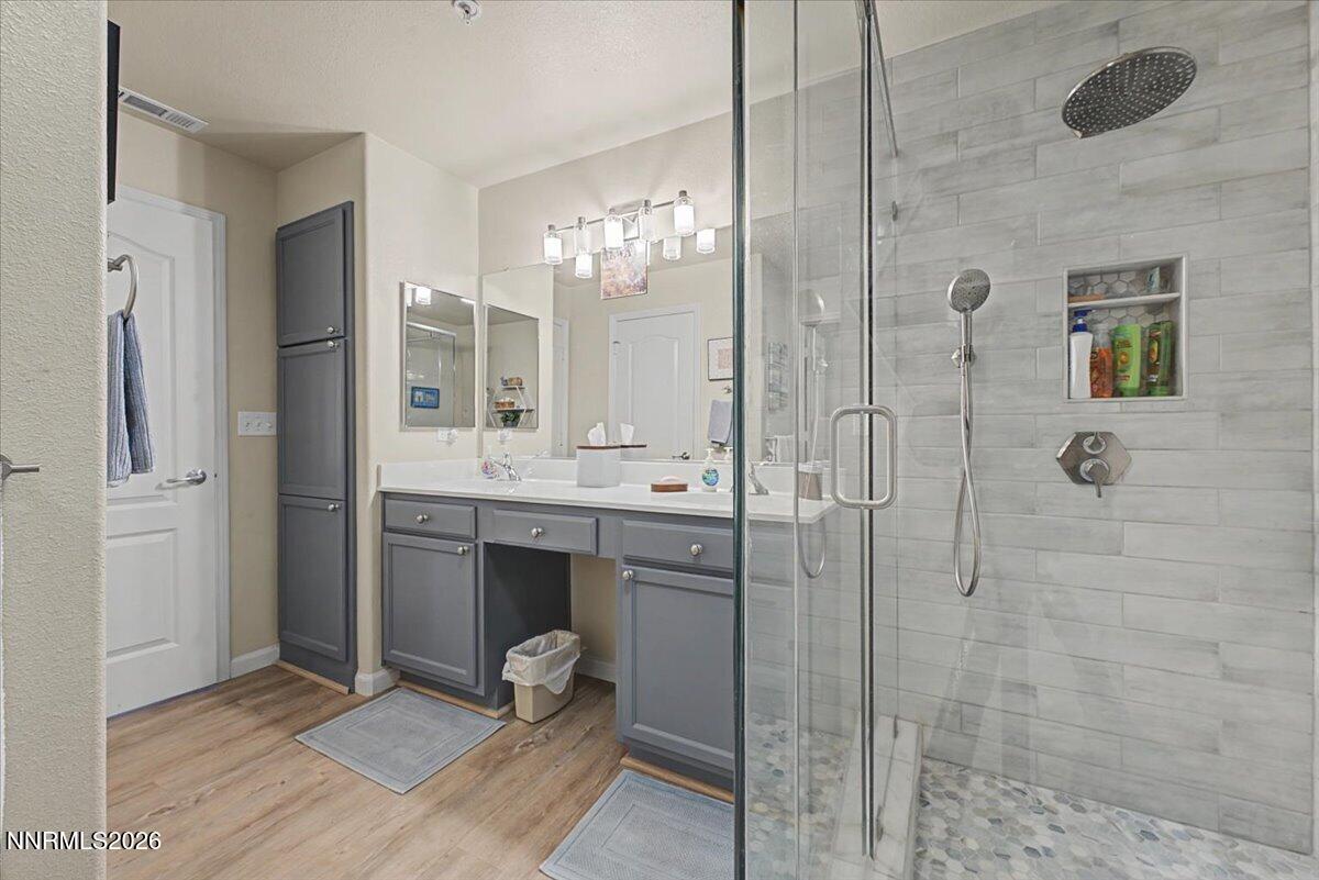 17000 Wedge Parkway, Unit 2625 Reno, NV 89511 - Photo 7 of 42 a bathroom with a mirror and a shower