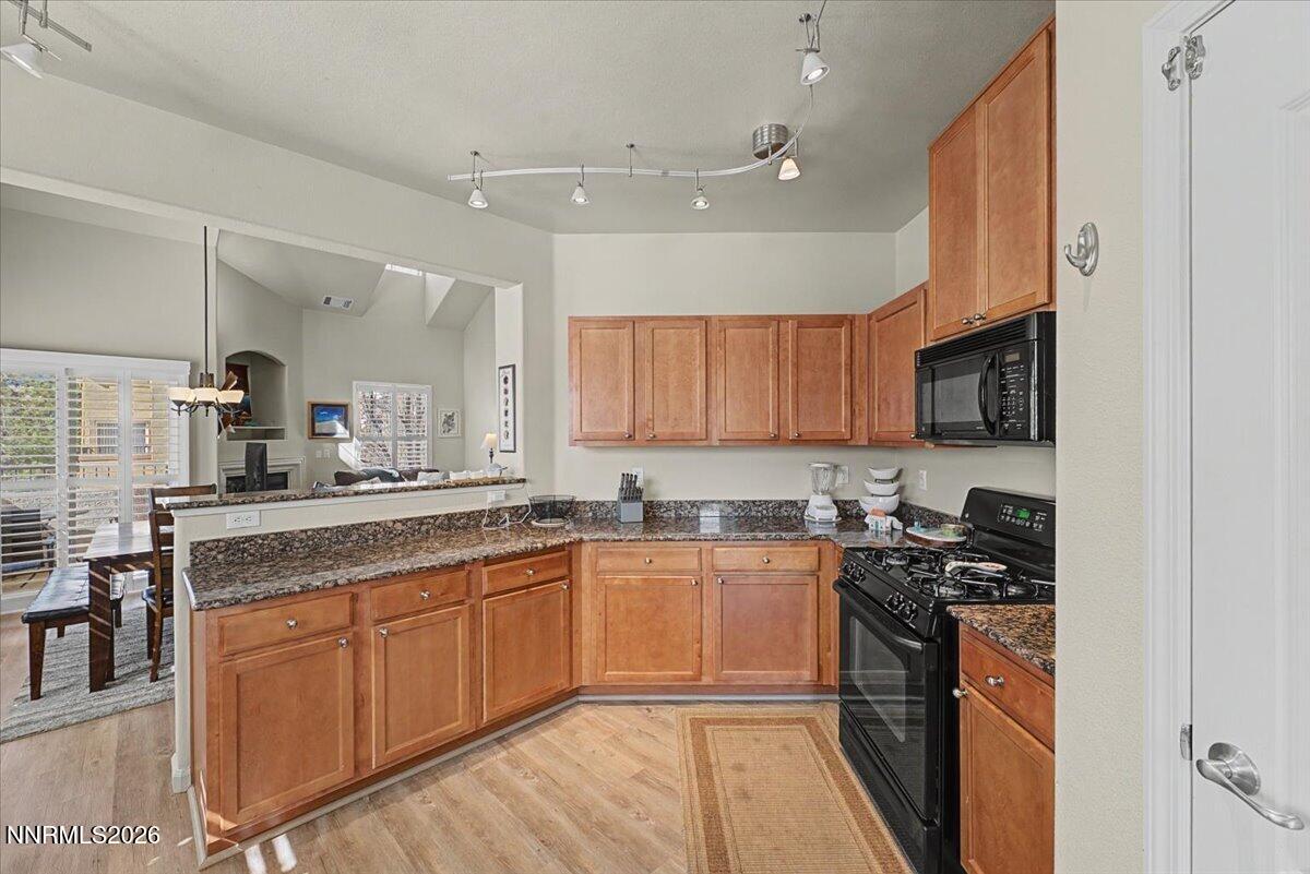 17000 Wedge Parkway, Unit 2625 Reno, NV 89511 - Photo 10 of 42 a kitchen with stainless steel appliances granite countertop a sink stove microwave and cabinets