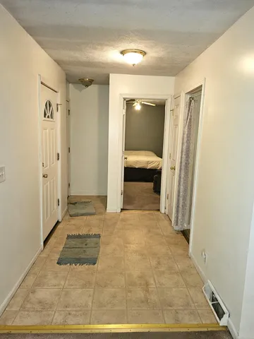 a view of a hallway to a room