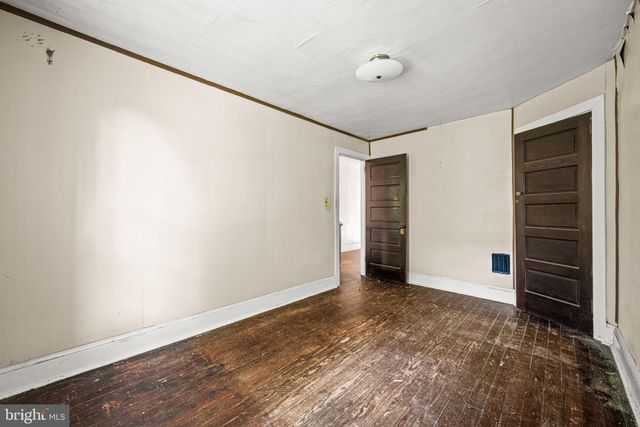 a bathroom with a sink a toilet and a window