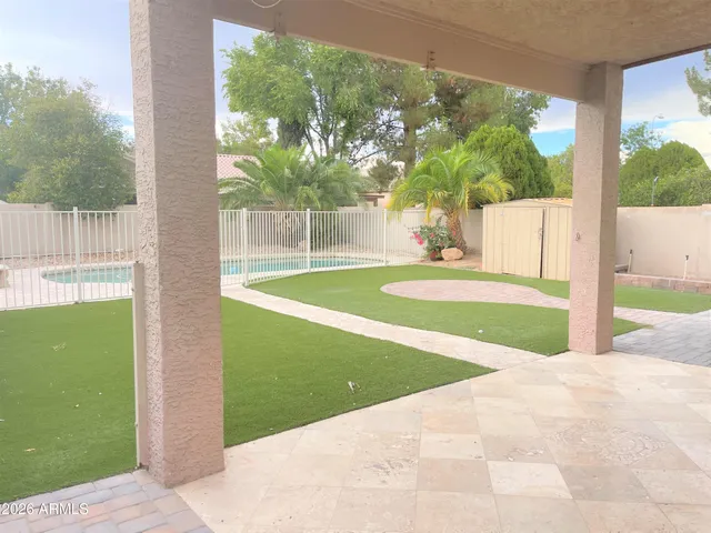 a view of backyard with green space