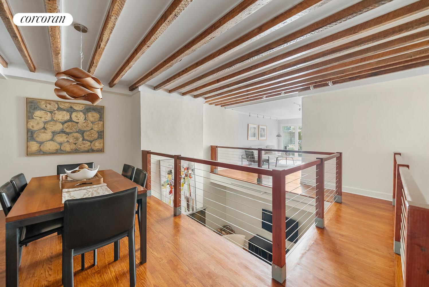 a hallway with a table and chairs