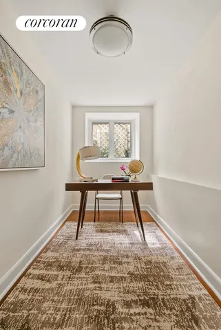 a bedroom with a bed and a chair