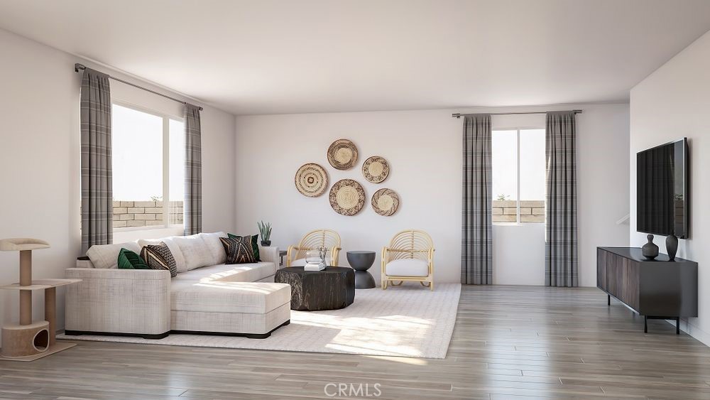 33436 Rusty Court French Valley, CA 92596 - Photo 6 of 14 a living room with fireplace furniture and a flat screen tv