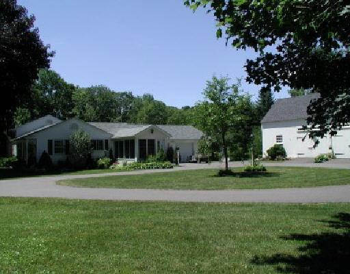 1 Jericho Road South Sherman, CT 06784 - Photo 1 of 1 a front view of a house with a yard and trees