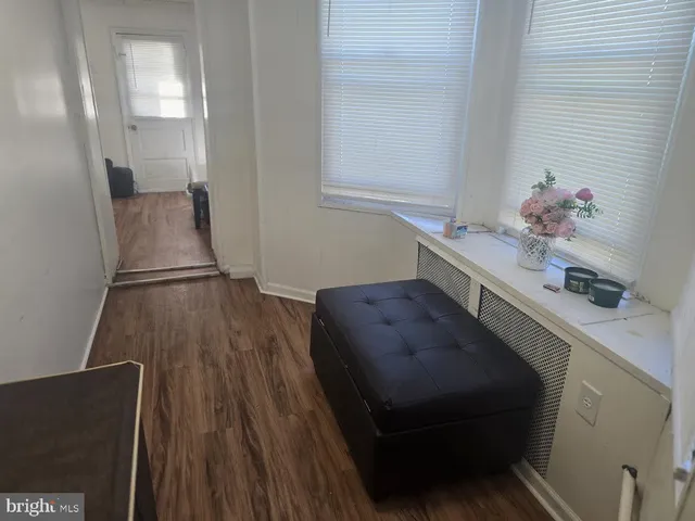 a room with furniture and wooden floor
