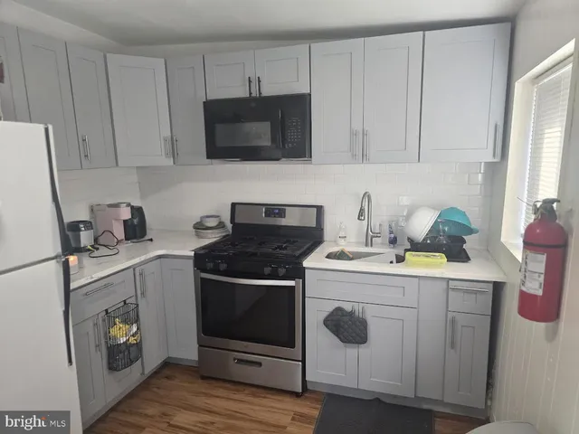 a kitchen with a stove and a microwave