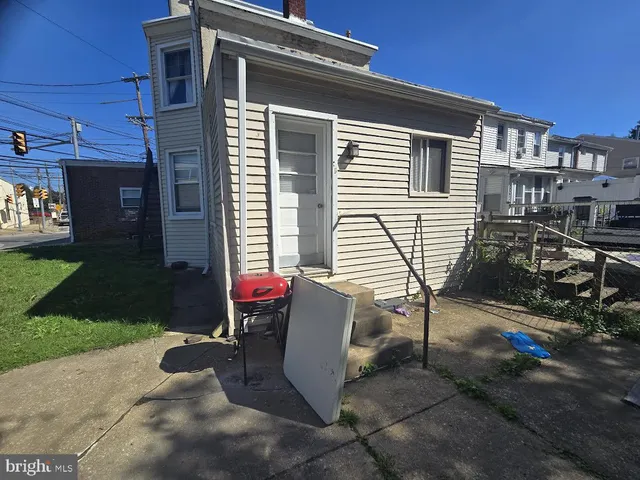 a view of a chairs and table in backyard