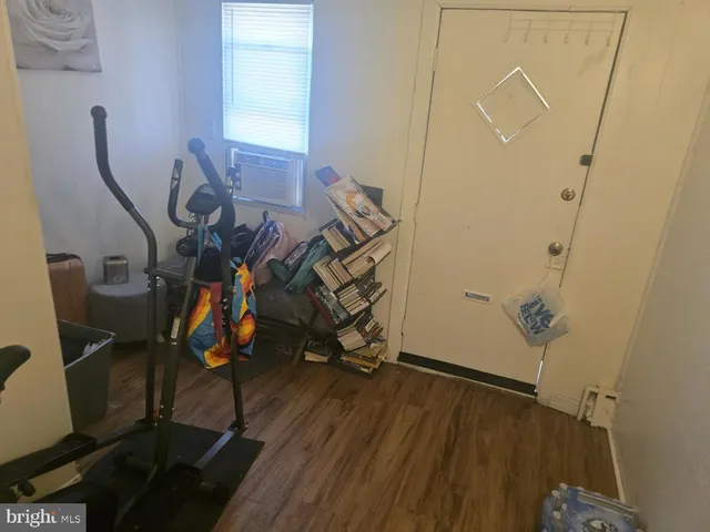 a view of an entryway with wooden floor