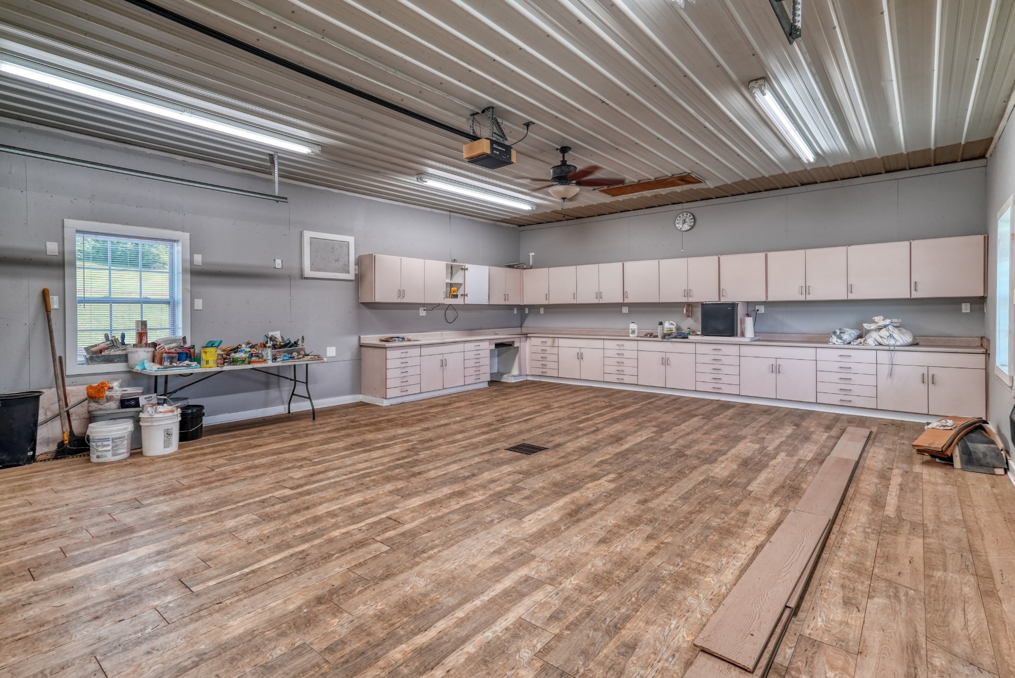 315 Blue And Gray Park Road Elkton, KY 42220 - Photo 19 of 66 a large kitchen with stainless steel appliances granite countertop a lot of counter space and a wooden floors