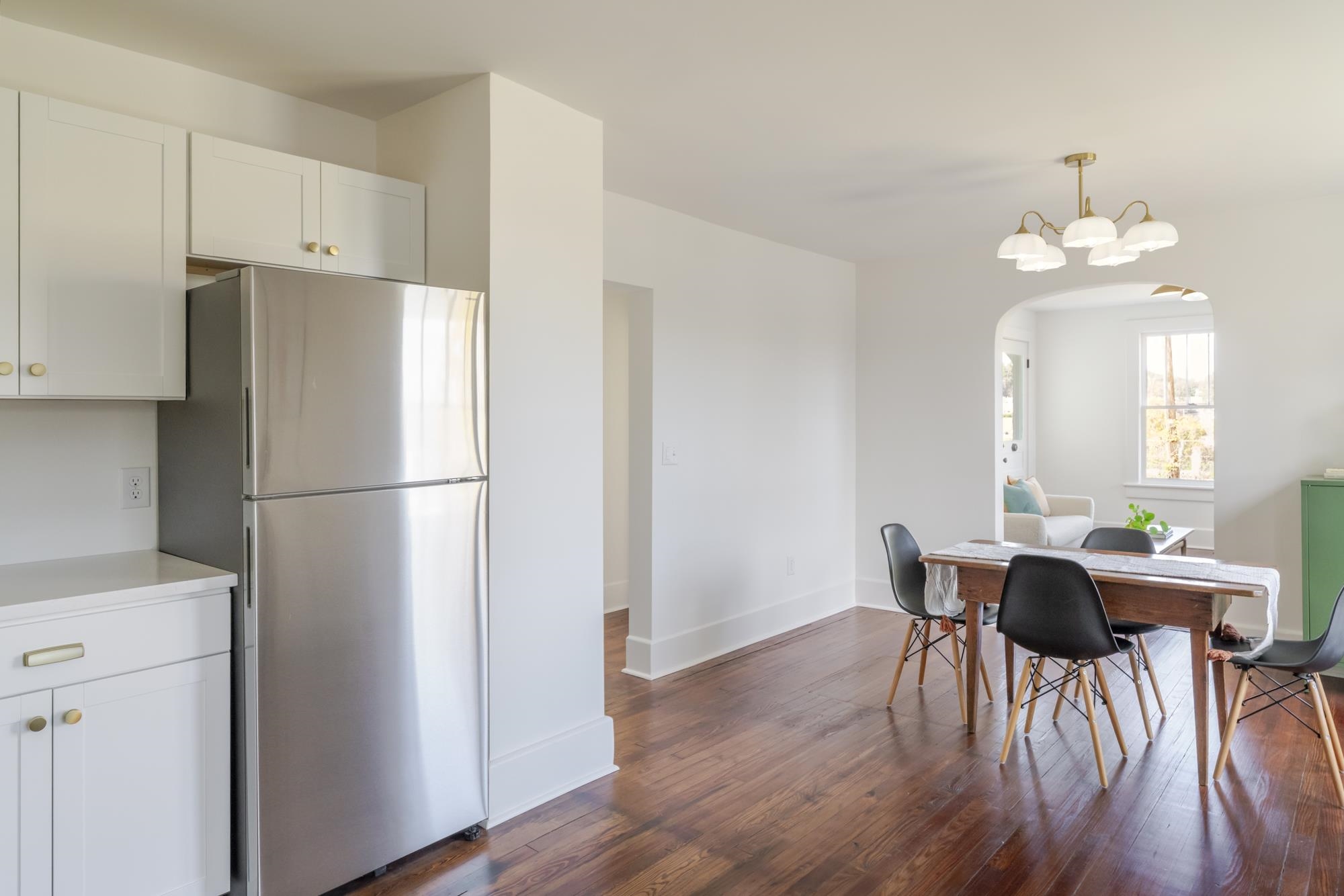 2216 Noon Street Staunton, VA 24401 - Photo 14 of 26 a kitchen with stainless steel appliances a refrigerator a dining table and chairs