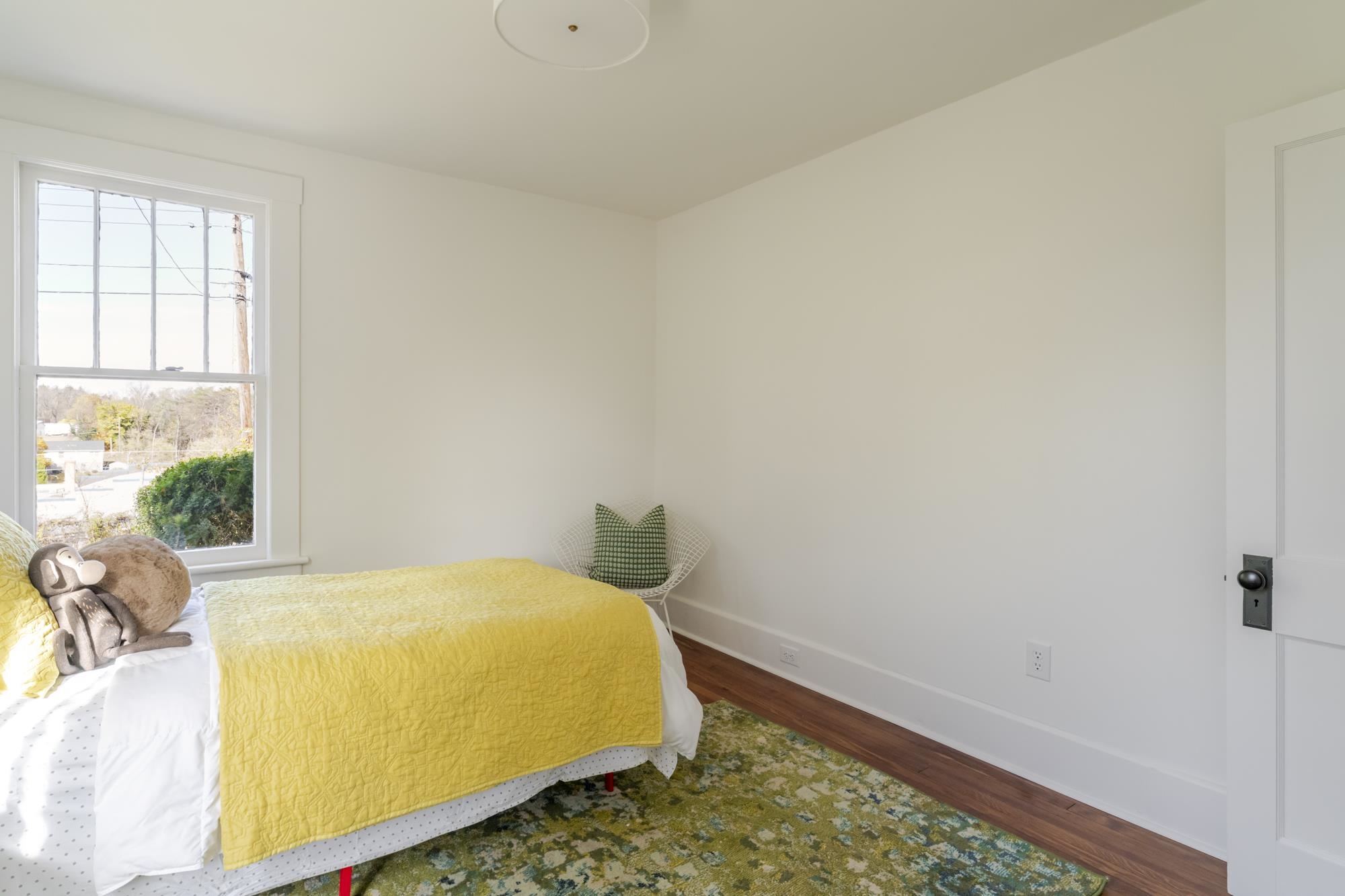 2216 Noon Street Staunton, VA 24401 - Photo 17 of 26 a bed sitting in a bedroom next to a window