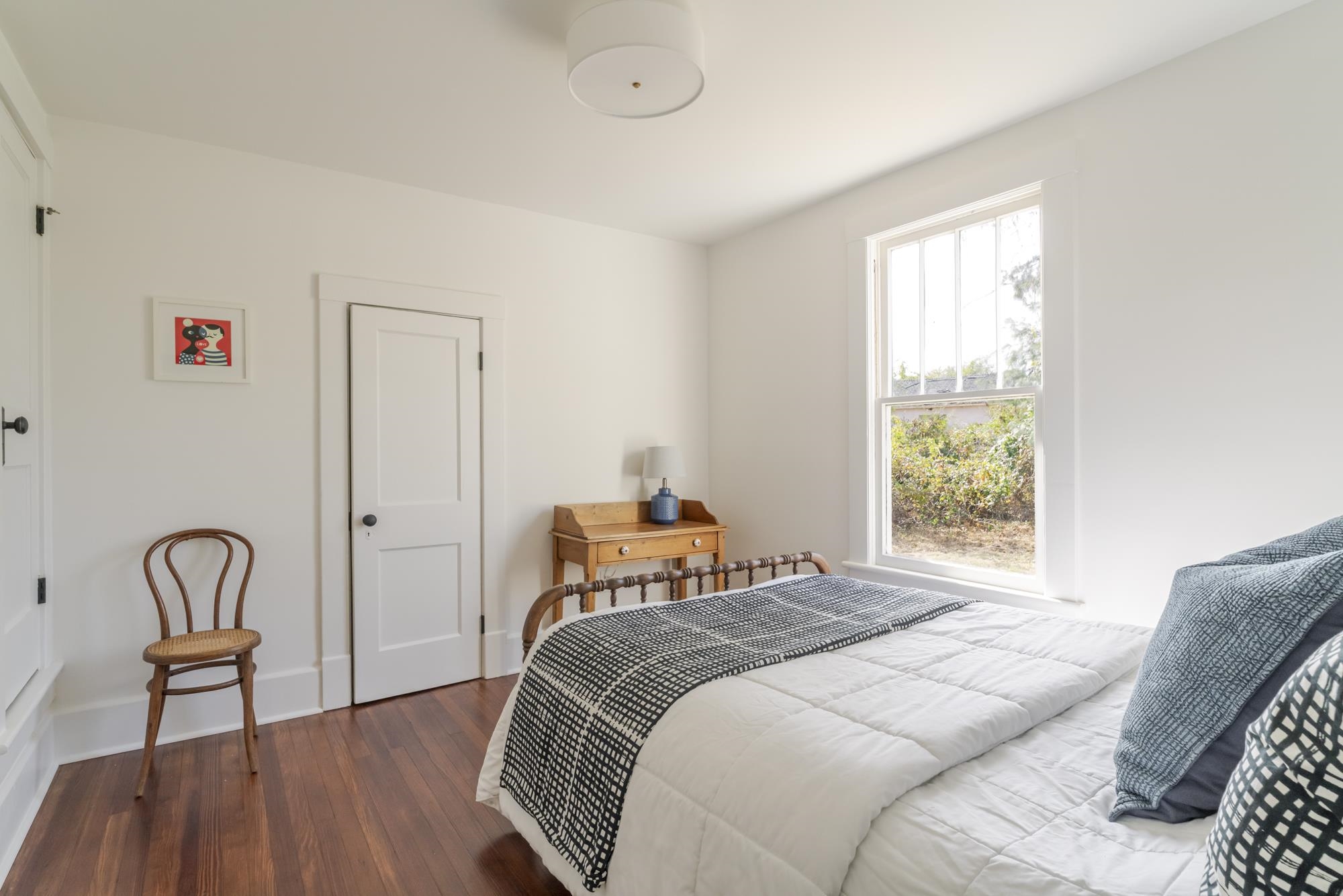 2216 Noon Street Staunton, VA 24401 - Photo 18 of 26 a bedroom with a bed and a chair