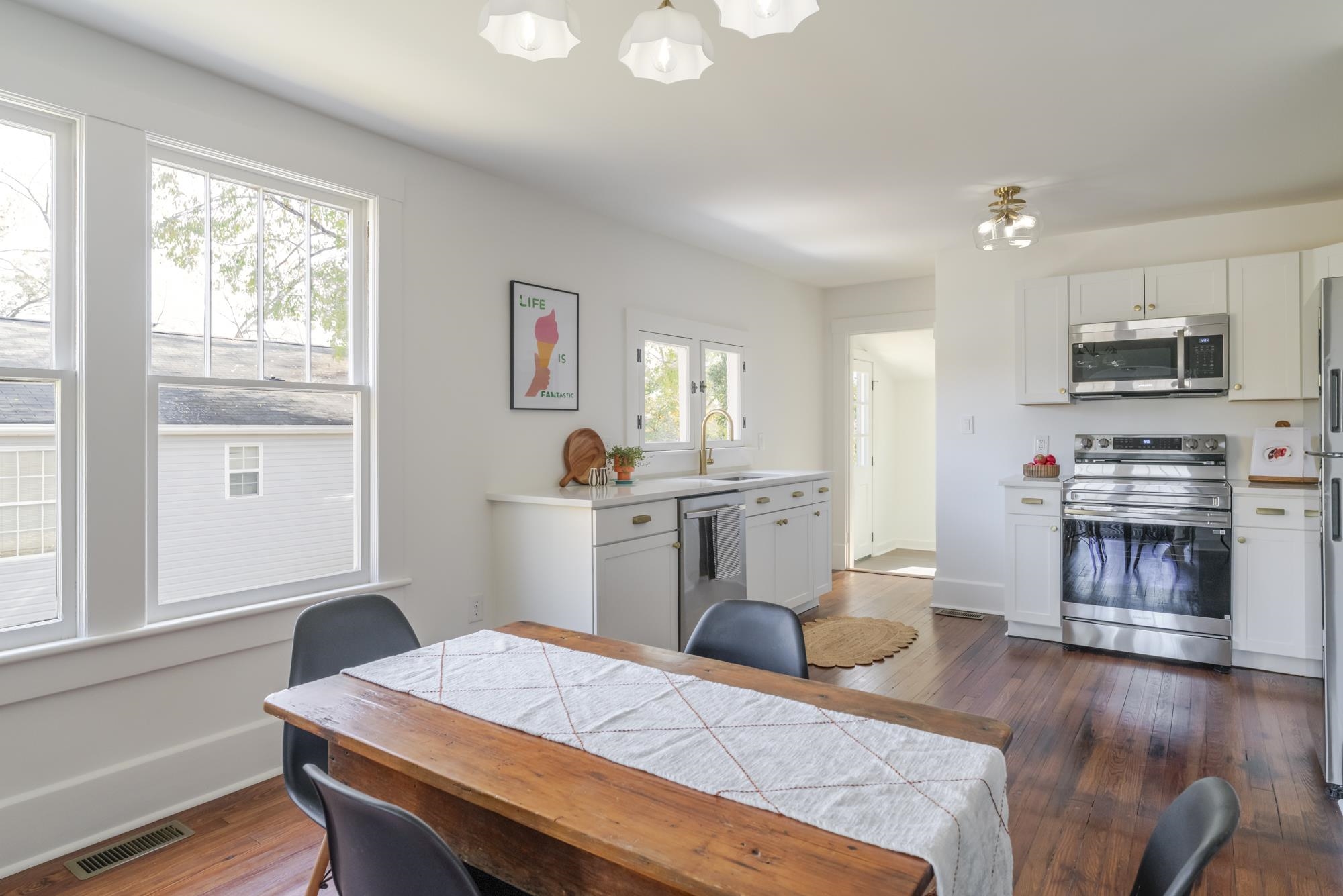 2216 Noon Street Staunton, VA 24401 - Photo 8 of 26 a kitchen with sink cabinets and wooden floor