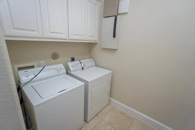 a view of storage and utility room with washer and dryer