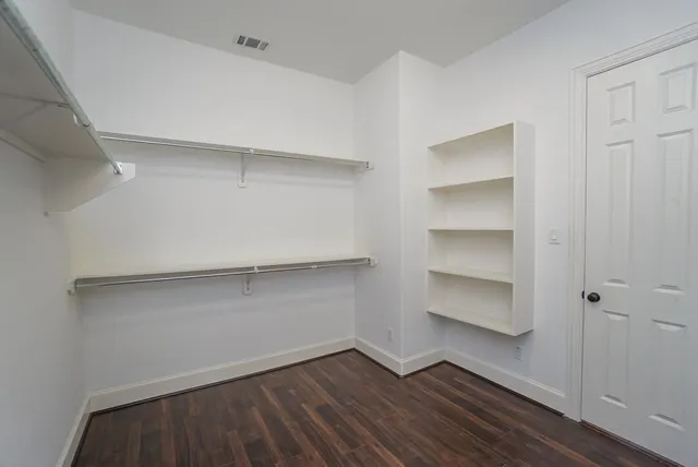 a view of an empty walk in closet