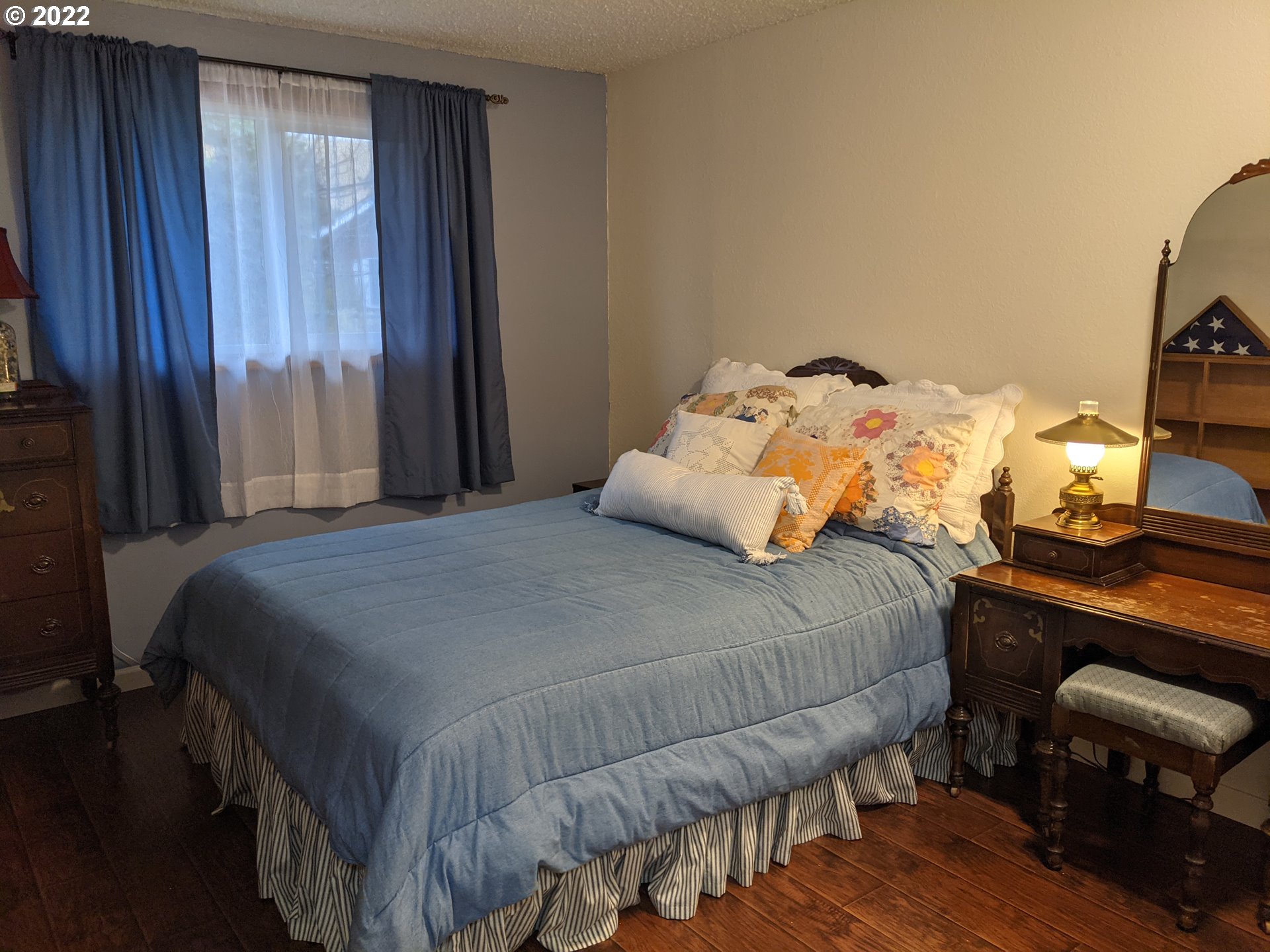 1447 Southwest 45th Street Pendleton, OR 97801 - Photo 13 of 21 a bedroom with a bed and wooden floor