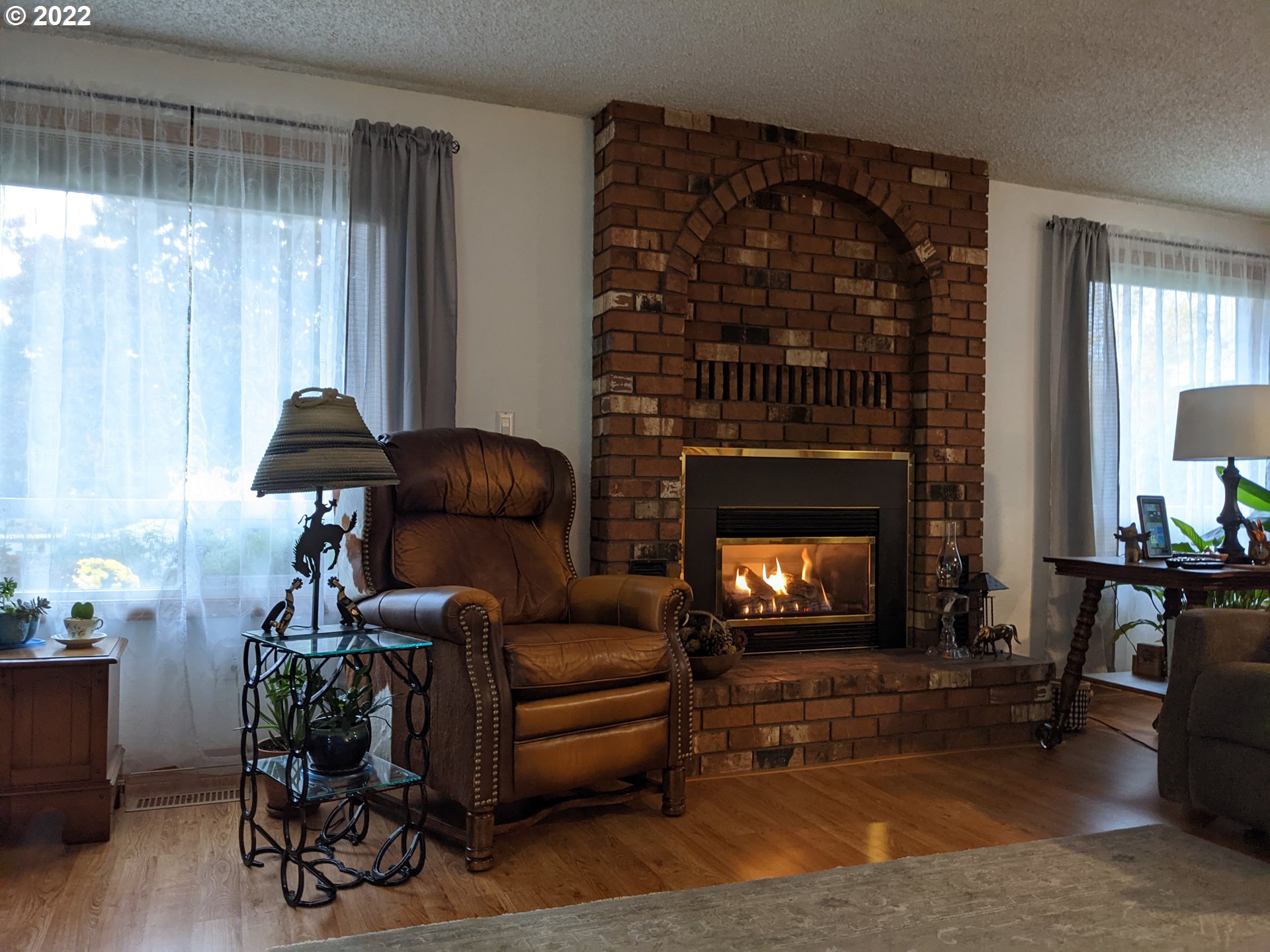 1447 Southwest 45th Street Pendleton, OR 97801 - Photo 4 of 21 a living room with furniture and a fireplace