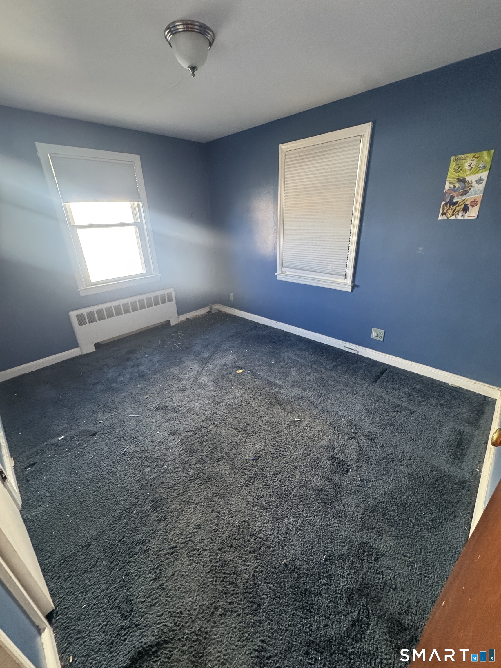 105 Crown Street Bristol, CT 06010 - Photo 12 of 20 an empty room with windows