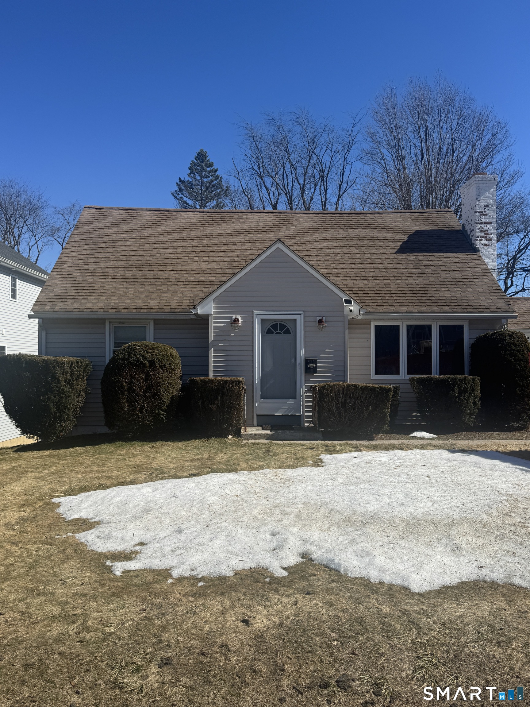 105 Crown Street Bristol, CT 06010 - Photo 2 of 20 a front view of a house with a yard