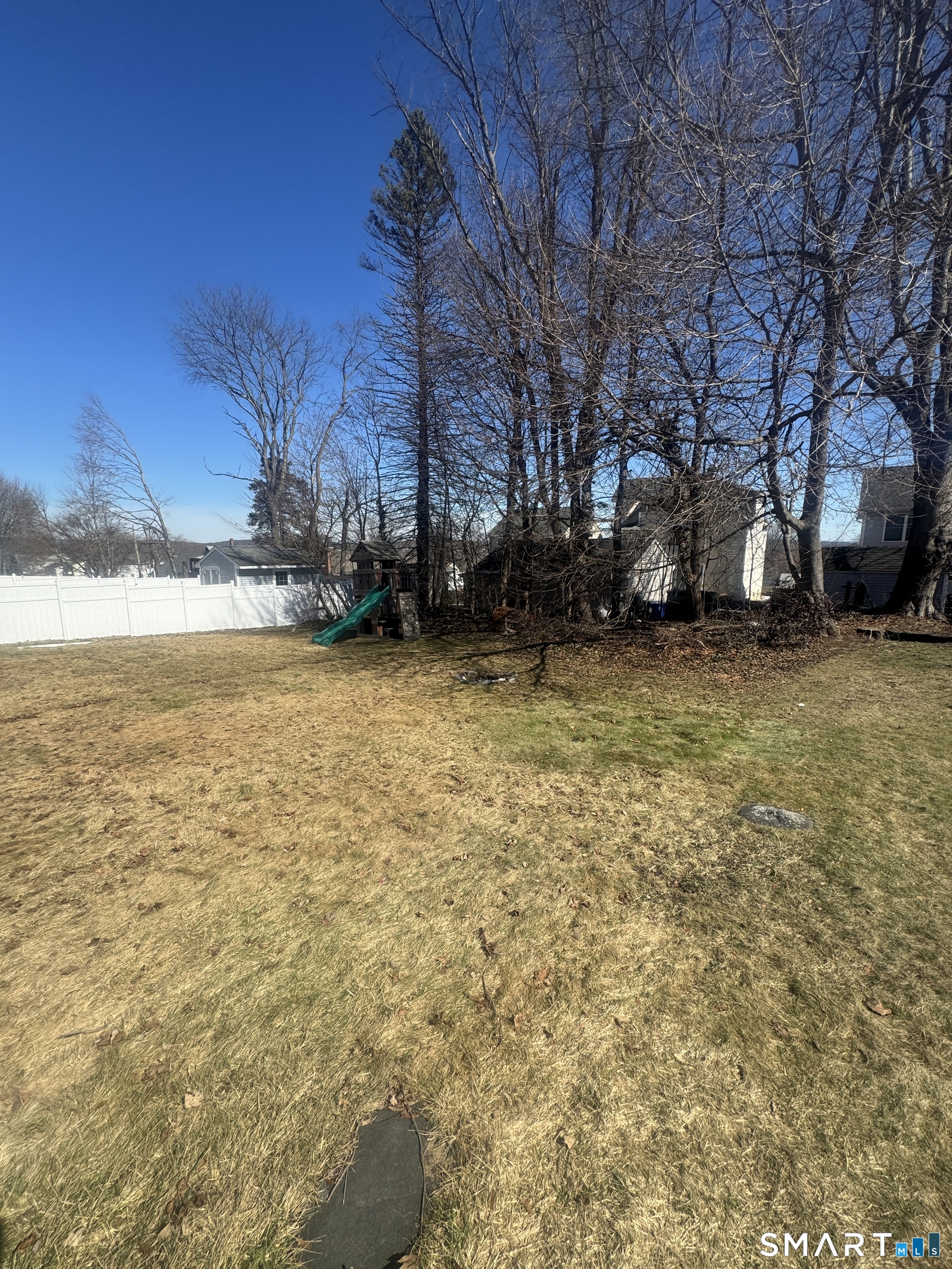 105 Crown Street Bristol, CT 06010 - Photo 5 of 20 a view of a lake with a building in the background