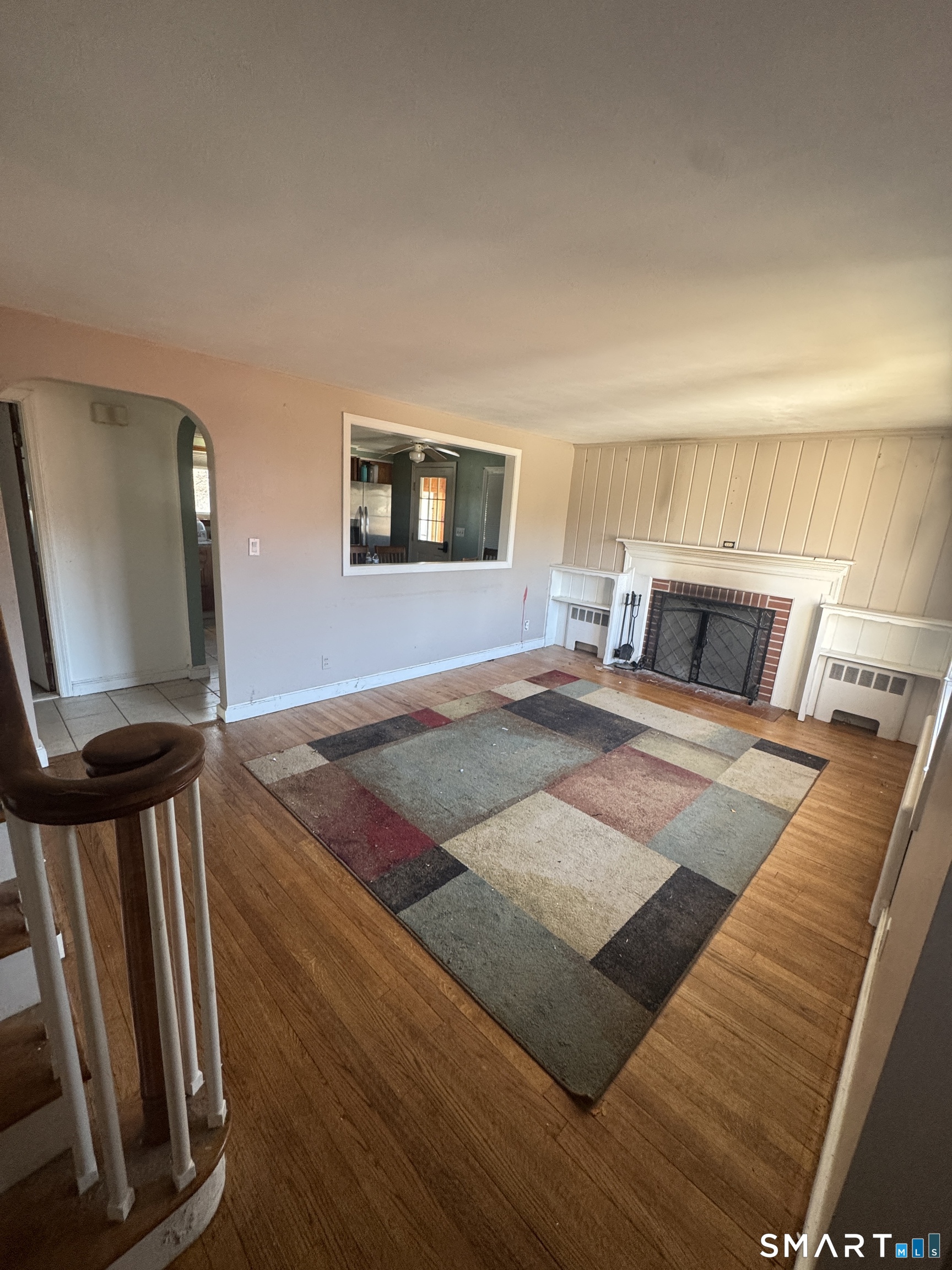 105 Crown Street Bristol, CT 06010 - Photo 10 of 20 a bedroom with a bed and wooden floor