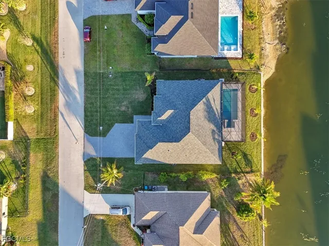an aerial view of a house with swimming pool