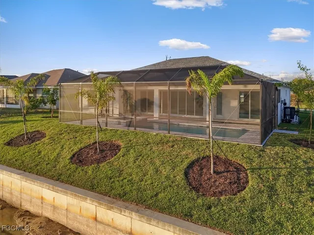 a front view of a house with lots of trees