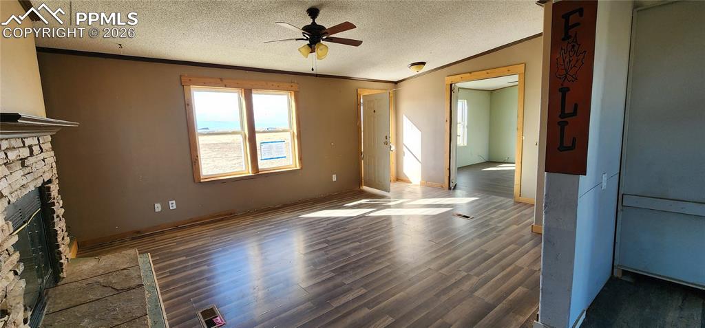 31995 North Neely Road Yoder, CO 80864 - Photo 12 of 21 a view of an empty room with window and wooden floor