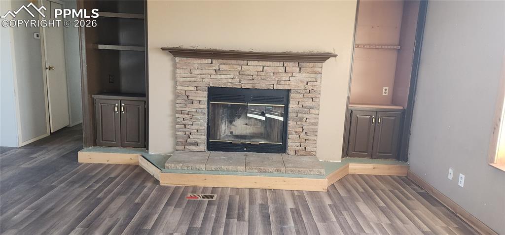 31995 North Neely Road Yoder, CO 80864 - Photo 14 of 21 a view of a livingroom with wooden floor and a fireplace