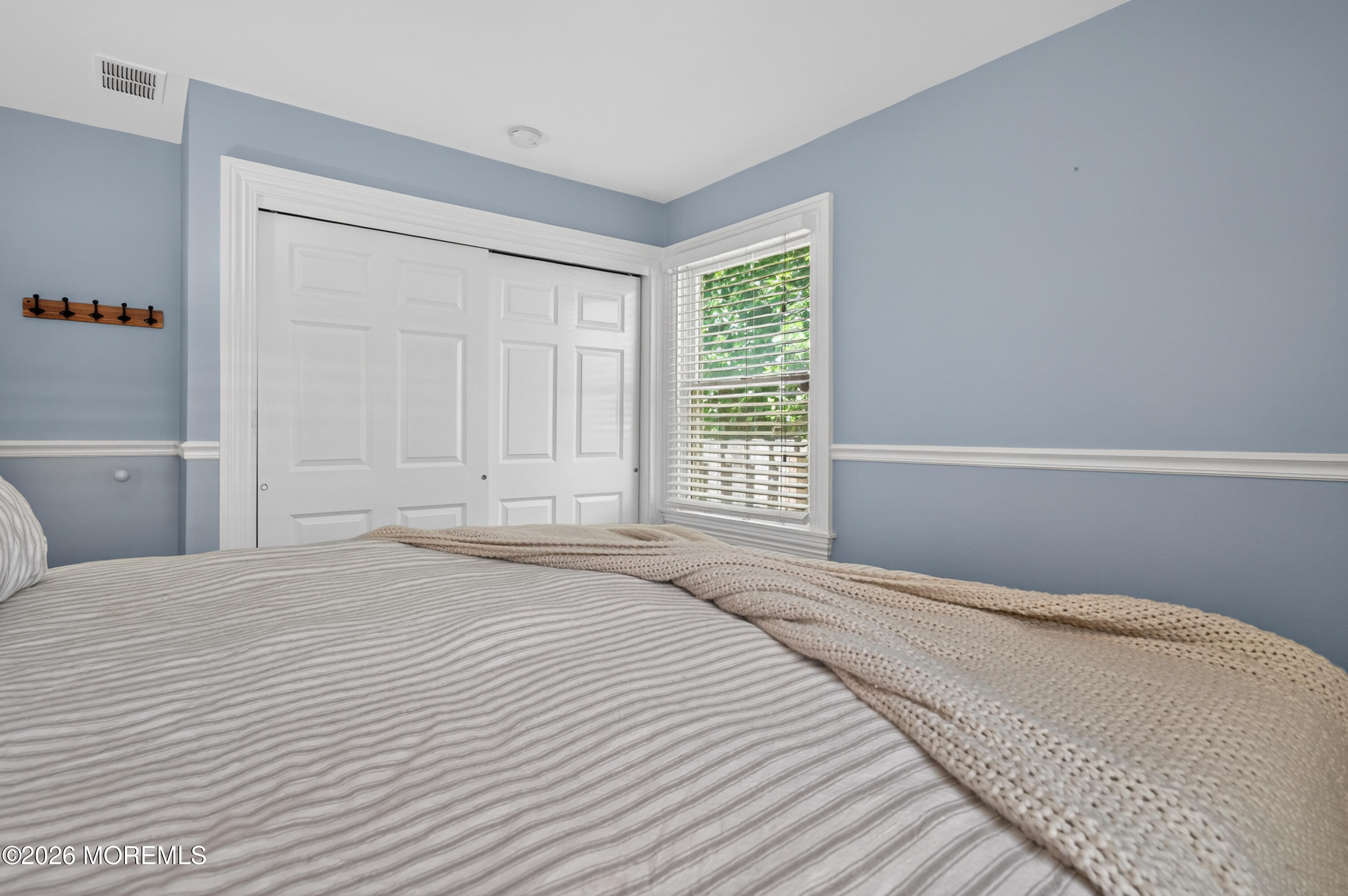 65 Heck Avenue Ocean Grove, NJ 07756 - Photo 25 of 37 a bedroom with a bed and a window