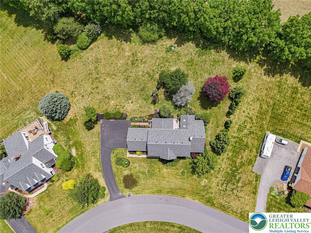 4542 Springfield Drive Coplay, PA 18037 - Photo 78 of 89 An aerial perspective showcases a generously sized property with ample green space and mature trees.